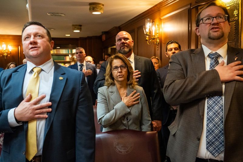 Members of the Indiana House of Representatives recite the Pledge of Allegiance at the beginning of the 124th meeting of the Indiana General Assembly. House Republicans recently met to consider mid-cycle redistricting.