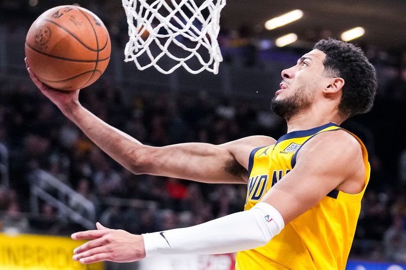 Indiana Pacers guard Tyrese Haliburton (0) goes up for a shot Friday, Jan. 10, 2025, during an NBA game between the Indiana Pacers and the Golden State Warriors at Gainbridge Fieldhouse in Indianapolis. The Pacers defeated the Warriors, 108-96.