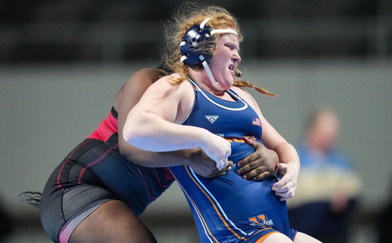 Harrison's Erin Cauble competes against North Central's Racheal Adolphe in the 235-pound bout on Friday, Jan. 17, 2026, during the inaugural IHSAA girls wrestling state finals at Corteva Coliseum at the Indiana State Fairgrounds in Indianapolis. Grace Hollars/IndyStar