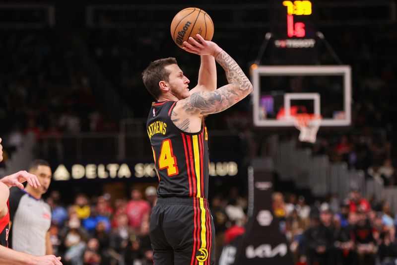 Jan 23, 2025; Atlanta, Georgia, USA; Atlanta Hawks guard Garrison Mathews (24) shoots against the Toronto Raptors in the second quarter at State Farm Arena. Mandatory Credit: Brett Davis-Imagn Images