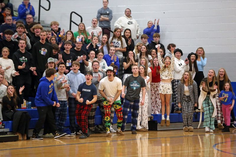 Triton students get excited after its team scored during the Bi-County Tournament boys basketball championship game against LaVille Saturday, Jan. 25, 2025, at LaVille High School in Lakeville.