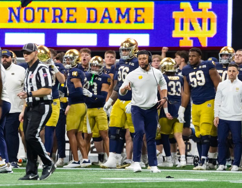 Jan 20, 2025; Atlanta, GA, USA; Notre Dame Fighting Irish head coach Marcus Freeman against the Ohio State Buckeyes during the CFP National Championship college football game at Mercedes-Benz Stadium. Mandatory Credit: Mark J. Rebilas-Imagn Images