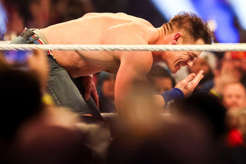 John Cena performs his “you can't see me” catchphrase Saturday, Feb. 1, 2025, during the WWE Royal Rumble at Lucas Oil Stadium in Indianapolis.