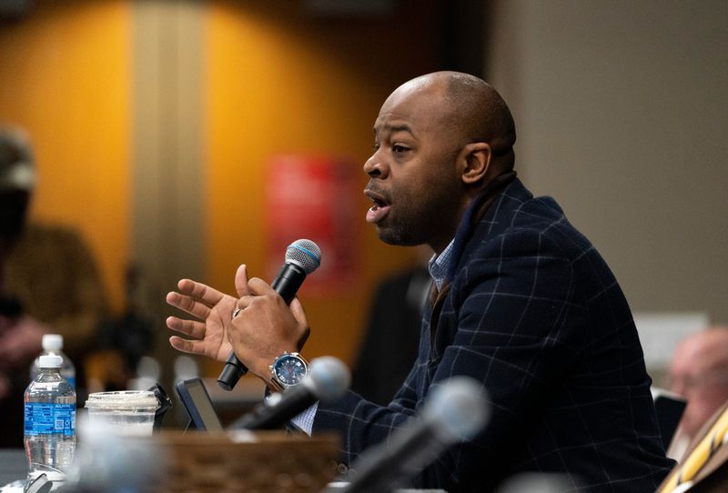 Rep. Alex Burton representing District 77 answers questions from the crowd during a "Meet Your Legislators" event in the Browning Room at Evansville Vanderburgh Public Library Central Saturday, Feb. 8, 2025.