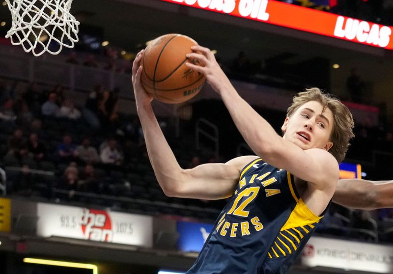 Indiana Pacers forward Johnny Furphy (12) gets the rebound against the New York Knicks during the second half of a game Tuesday, Feb. 11, 2025, at Gainbridge Fieldhouse in Indianapolis. The Knicks defeated the Pacers 128-115.