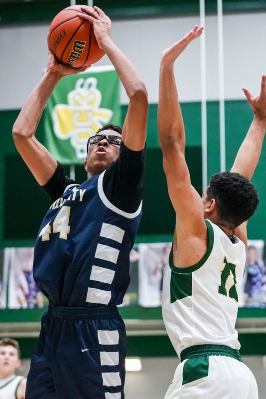 University Trailblazers forward Josh Henderson (44) goes up for a shot against Westfield Shamrocks Jalen Malone (12) on Tuesday, Feb. 18, 2025, during a boys basketball game between the Westfield Shamrocks and the University Trailblazers at Westfield High School. The Shamrocks defeated University, 60-31.