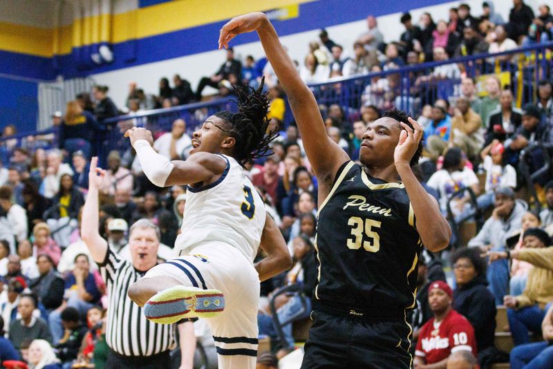 Penn's Peyton Miamba (35) and Riley's Tyrese Jones (3) watch Miamba's three point shot go in the basket during the NIC boy's basketball championship game between Riley and Penn at Riley High School on Friday, Feb. 21, 2025, in South Bend.