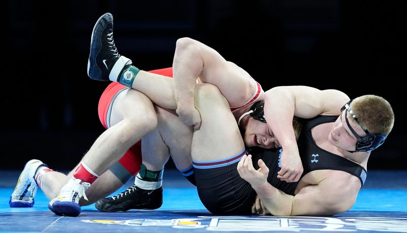 Rossville's Noah Weaver competes against Hanover Central's Jayden Bartoszek in the 215-pound bout Saturday, Feb. 22, 2025, during the IHSAA boys wrestling state finals at Gainbridge Fieldhouse in Indianapolis.