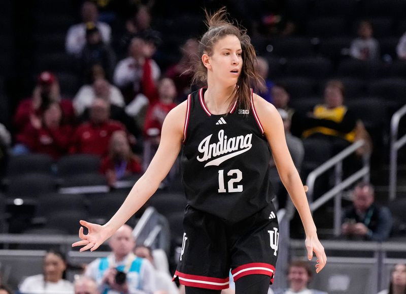 Indiana Hoosiers guard Yarden Garzon (12) celebrates scoring a three point basket Thursday, March 6, 2025, during the Big Ten women's tournament at Gainbridge Fieldhouse in Indianapolis. Indiana Hoosiers defeated the Oregon Ducks, 78-62.