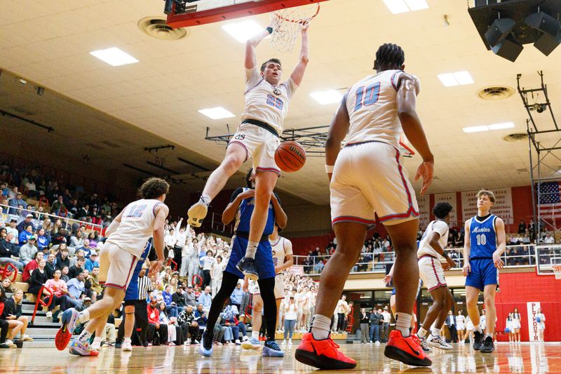 Saint Joseph's Chase Konieczny (20) dunks the ball during an IHSAA 3A Sectional boys basketball game between Saint Joseph and Mishawaka Marian at Plymouth High School on Friday, March 7, 2025, in Plymouth.