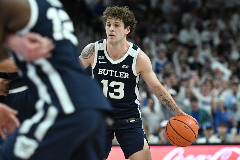 Mar 8, 2025; Omaha, Nebraska, USA; Butler Bulldogs guard Finley Bizjack (13) dribbles against the Creighton Bluejays during the first half at CHI Health Center Omaha. Mandatory Credit: Steven Branscombe-Imagn Images