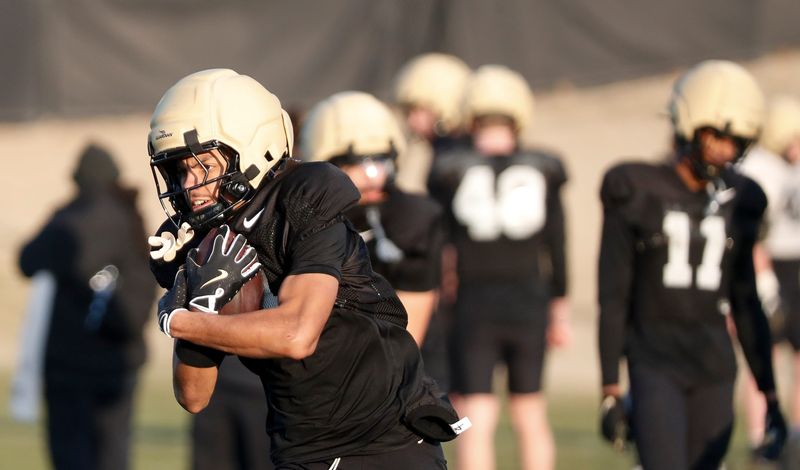 Purdue Boilermakers wide receiver Charles Ross (4) catches a pass Thursday, March 13, 2025, during Purdue football practice at Kozuch Football Performance Complex in West Lafayette, Ind.