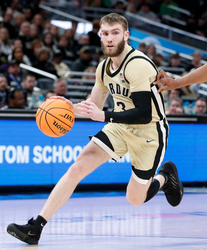 Purdue Boilermakers guard Braden Smith (3) drives to the basket Thursday, March 13, 2025, during the Big Ten Men’s Basketball Tournament game against the USC Trojans at Gainbridge Fieldhouse in Indianapolis.
