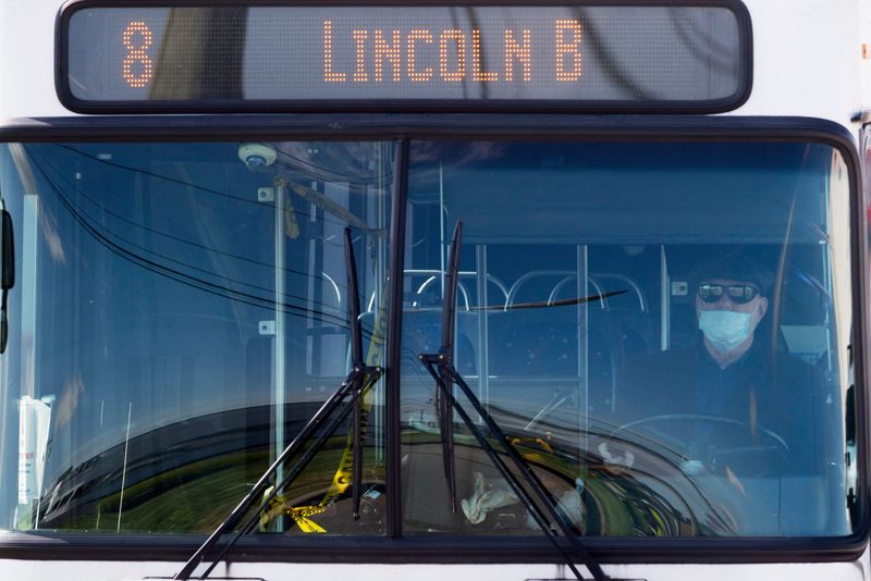 METS bus driver Jim Roehm wears a mask as he heads down North Green River Road Wednesday morning, May 6, 2020. The amount of riders allowed on the bus has been reduced to nine due to Indiana’s “Stay-at-Home” executive order from Gov. Eric Holcomb to help stop spread of COVID-19.