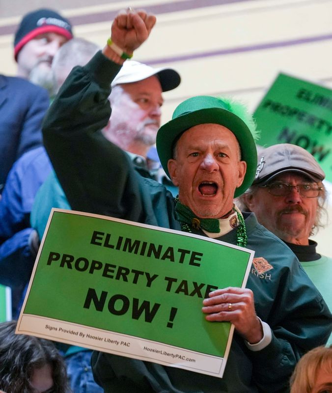 Attendee Bob Callon cheers during a rally for property tax reform Monday, March 17, 2025, at the Indiana Statehouse.