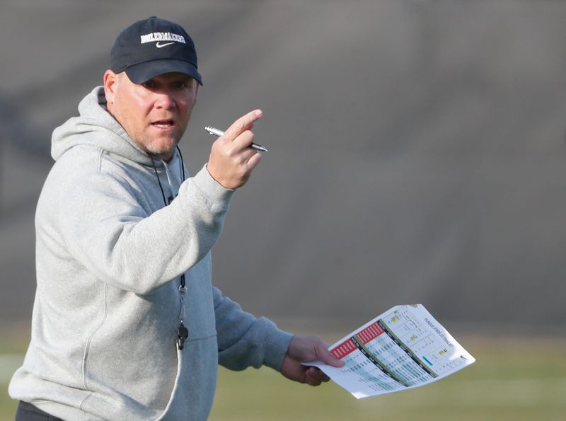 Purdue Boilermakers head coach Barry Odom looks down field Thursday, March 27, 2025, during football practice at Kozuch Football Performance Complex in West Lafayette, Ind.