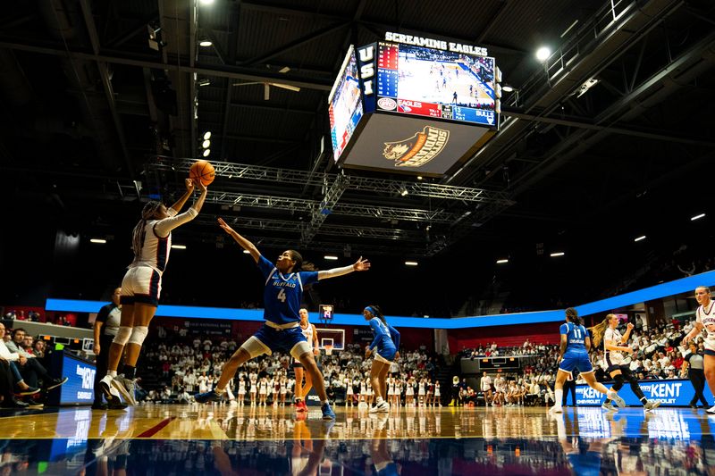 Southern Indiana's Triniti Ralston (4) takes a three-point shot as the University of Southern Indiana Screaming Eagles play the University of Buffalo Bulls during the WNIT Super 16 at Liberty Arena in Evansville, Ind., Thursday, March 27, 2025.