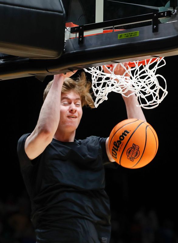 Purdue Boilermakers center Daniel Jacobsen (12) dunks the ball Friday, March 28, 2025, ahead of the NCAA Tournament Sweet 16 game against the Houston Cougars at Lucas Oil Stadium in Indianapolis.
