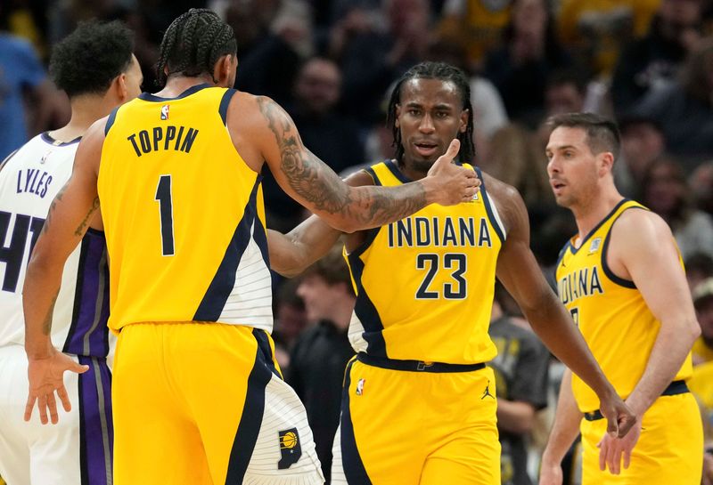 Indiana Pacers forward Aaron Nesmith (23) and forward Obi Toppin (1) celebrate after Nesmith scores against the Sacramento Kings during the second half of a game Monday, March 31, 2025, at Gainbridge Fieldhouse in Indianapolis. The Pacers defeated the Kings 111-109.