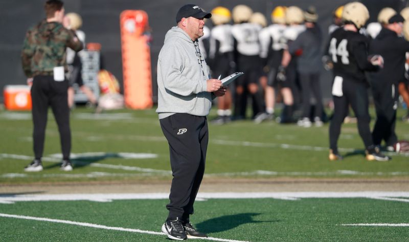 Purdue Boilermakers head coach Barry Odom looks down field Tuesday, April 1, 2025, during football practice at Kozuch Football Performance Complex in West Lafayette, Ind.