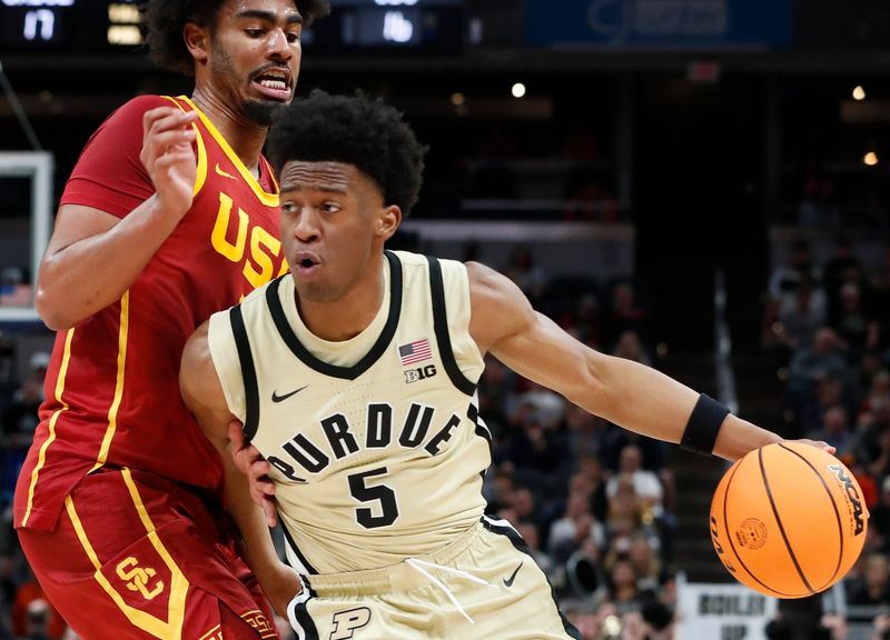 USC Trojans forward Saint Thomas (0) defends Purdue Boilermakers guard Myles Colvin (5) Thursday, March 13, 2025, during the Big Ten MenÃ¢â‚¬â„¢s Basketball Tournament game at Gainbridge Fieldhouse in Indianapolis.