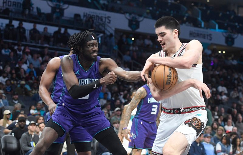 April 8: The Memphis Grizzlies' Zach Edey (right) gets the ball stripped by the Charlotte Hornets' Mark Williams during the second half at the Spectrum Center. The Grizzlies won the game, 124-100.