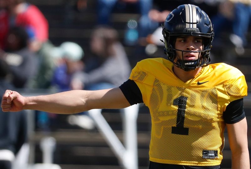 Purdue Boilermakers quarterback Evans Chuba (1) signals a play Saturday, April 12, 2025, during the spring showcase at Ross-Ade Stadium in West Lafayette, Ind.