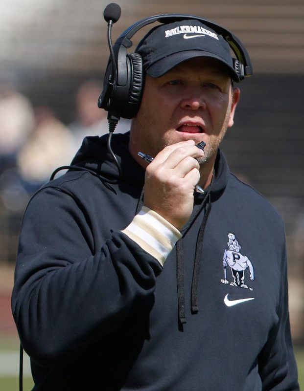 Purdue Boilermakers head coach Barry Odom speaks into his headset Saturday, April 12, 2025, during the spring showcase at Ross-Ade Stadium in West Lafayette, Ind.