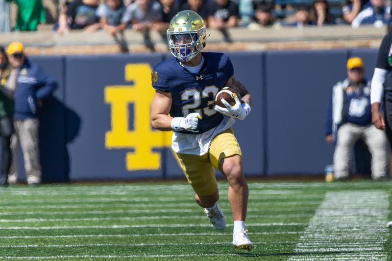 Apr 12, 2025; Notre Dame, IN, USA; Notre Dame Fighting Irish running back Nolan James Jr. (23) runs the ball during the Blue-Gold game at Notre Dame Stadium. Mandatory Credit: Michael Caterina-Imagn Images