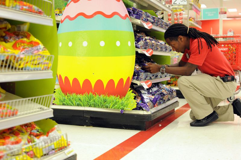 Target employee Darrius Florence organizes rows of Easter candy at Target in 2015.