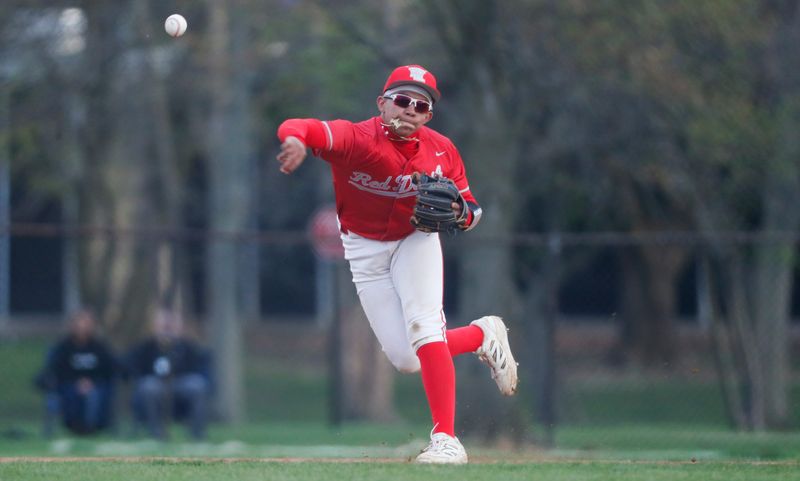 West Lafayette Red Devils LJ Whitford (3) throws the ball to first base Thursday, April 17, 2025, during the IHSAA baseball game against the Harrison Raiders at Bob Friend Baseball Field, in West Lafayette, Indiana. Harrison won 11-0.
