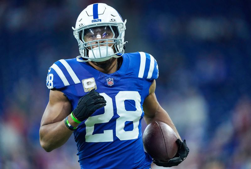 Indianapolis Colts running back Jonathan Taylor (28) jogs up the field Sunday, Nov. 10, 2024, ahead of a game against the Buffalo Bills at Lucas Oil Stadium in Indianapolis.