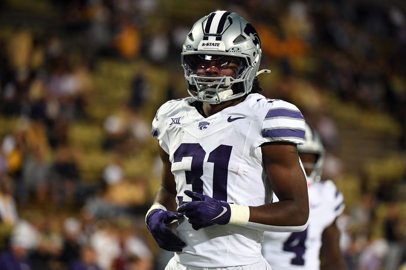 Oct 12, 2024; Boulder, Colorado, USA; Kansas State Wildcats running back DJ Giddens (31) warms up before the game against the Colorado Buffaloes at Folsom Field. Mandatory Credit: Christopher Hanewinckel-Imagn Images