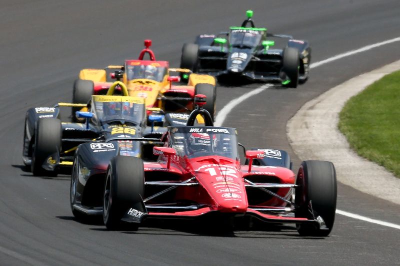 Team Penske driver Will Power (12) moves through a turn Monday, May 22, 2023, during practice ahead of the 107th running of the Indianapolis 500 at Indianapolis Motor Speedway.