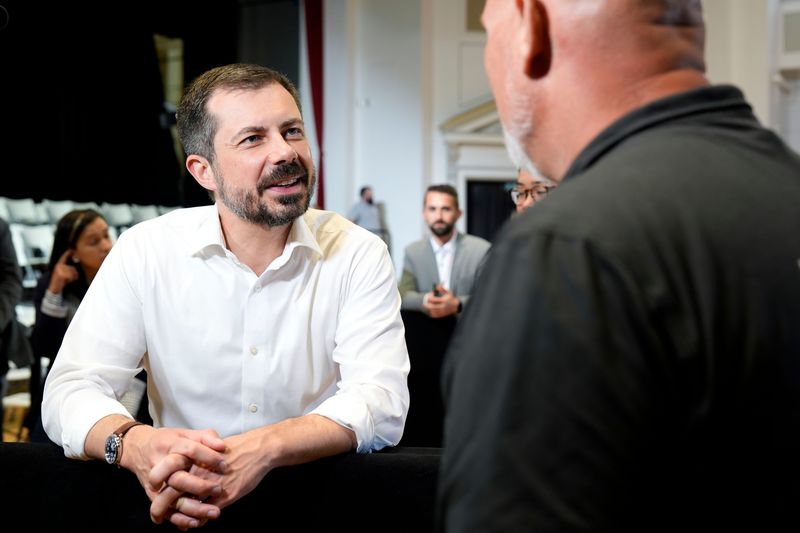 Former U.S. Secretary of Transportation Pete Buttigieg shakes hands after a town hall hosted by VoteVets May 13, 2025 in Cedar Rapids, Iowa.