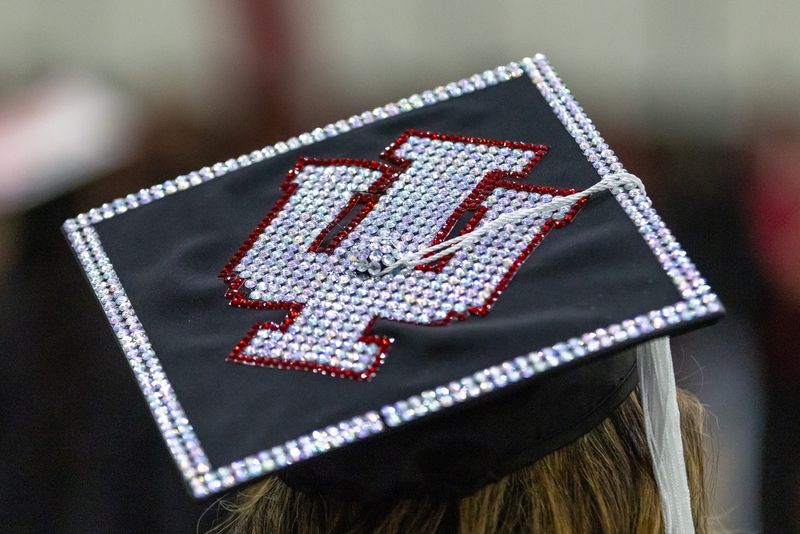 A graduate wears an IU Trident decorated mortar board IU South Bend Commencement in South Bend on Tuesday, Jan. 16, 2024. (Photo by Michael Caterina for Indiana University South Bend)