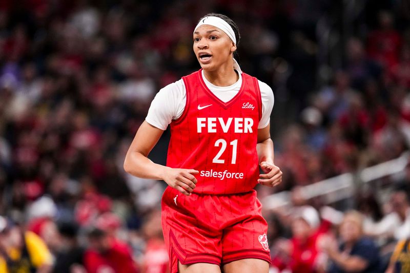 Indiana Fever forward Makayla Timpson (21) runs down the court Saturday, May 17, 2025, during a game between the Indiana Fever and the Chicago Sky at Gainbridge Fieldhouse in Indianapolis. The Indiana Fever defeated the Chicago Sky, 93-58.