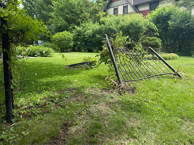 Jack Jackson's fence was damaged by an off-duty Anderson police officer's maroon Dodge Challenger that was stolen and crashed on May 19, 2025.
