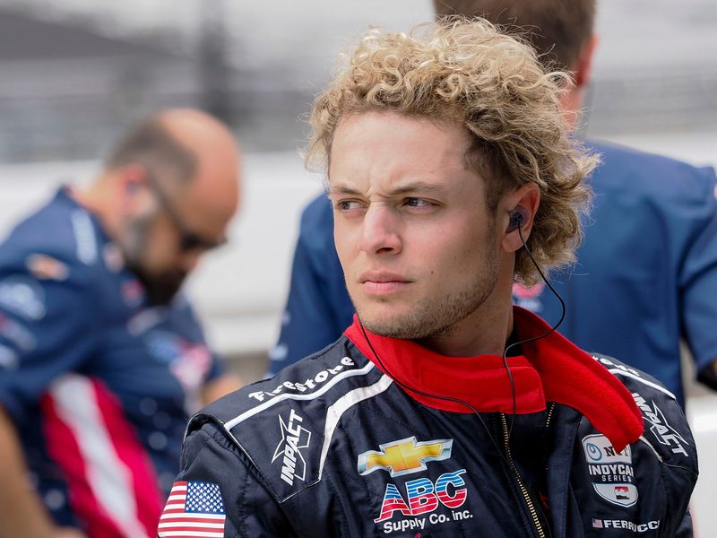 A. J. Foyt Enterprises driver Santino Ferrucci (14) stands by his car Wednesday, May 14, 2025, during a practice for the 109th running of the Indianapolis 500 at Indianapolis Motor Speedway.