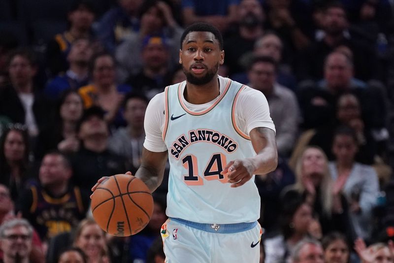 Apr 9, 2025; San Francisco, California, USA; San Antonio Spurs guard Blake Wesley (14) dribbles the ball upcourt in the third quarter against the Golden State Warriors at Chase Center. Mandatory Credit: David Gonzales-Imagn Images