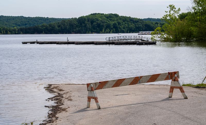 A barrier at the flooded boat ramp at the Cutright State Recreation Area on Saturday, May 24, 2025.
