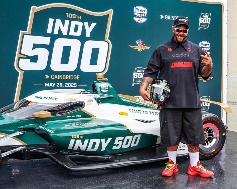 'America The Beautiful' singer Ephraim Owens walks the red carpet on Sunday, May 25, 2025, ahead of the 109th running of the Indianapolis 500 at Indianapolis Motor Speedway.