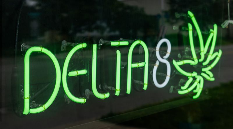 A Delta 8 neon sign Tuesday, May 27, 2025, at Popular Vape and Smoke in Fountain Square.