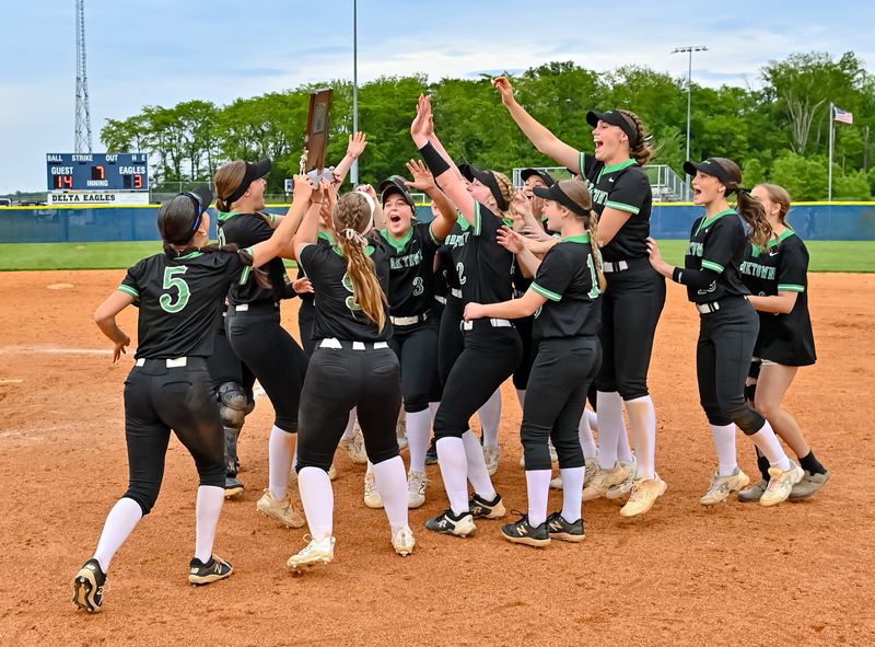 The Yorktown softball team celebrates with the IHSAA sectional trophy following Yorktown's 14-3 win over Hamilton Heights in the IHSAA Sectional 24 championship at Delta High School on Thursday, May 29, 2025.