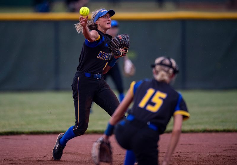 Castle's Emma Bruggenschmidt (12) throws to first as the Castle Knights play the North Huskies during the IHSAA Class 4A Softball Sectional championship game at North High School in Evansville, Ind., Thursday, May 29, 2025.