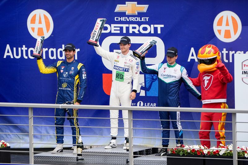 IndyCar NXT driver Dennis Hauger, center, celebrates his win in the Indy NXT race during Detroit Grand Prix in Detroit on Sunday, June 1, 2025.