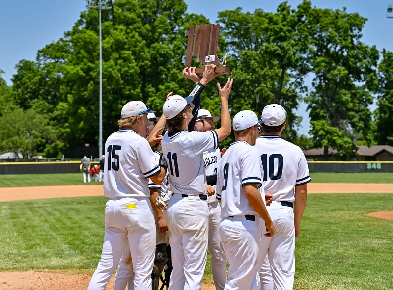 Delta players raise the trophy after beating Hamilton Heights, 13-0, in an IHSAA Class 3A baseball sectional championship game Monday, June 2, 2025, at Yorktown High School.