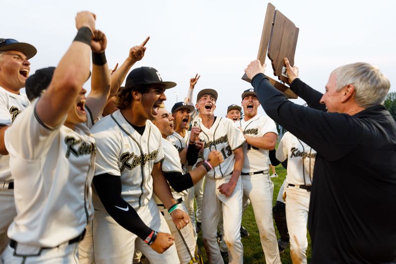Penn-Harris-Madison Superintendent Jerry Thacker, right, presents the Penn baseball team with its trophy after winning the IHSAA 4A Sectional baseball championship game 10-5 against LaPorte at LaPorte High School on Monday, June 2, 2025, in LaPorte.