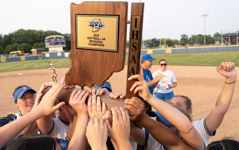 Greenfield-Central players celebrate Tuesday, June 3, 2025, after the Greenfield-Central Cougers defeated the Lawrence North Wildcats in the IHSAA class 4A regional game at Greenfield-Central High School in Greenfield, Indiana.