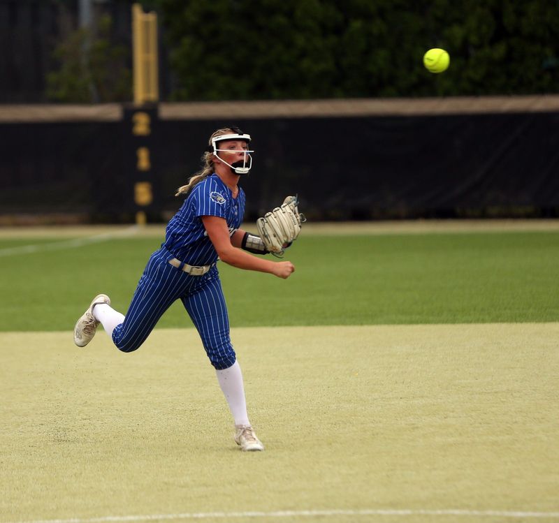 Elkhart sophomore Ava Walker throws out a runner from her shortstop position during an IHSAA Class 4A softball regional championship game against Penn Thursday, June 5, 2025, at Penn High School in Mishawaka.